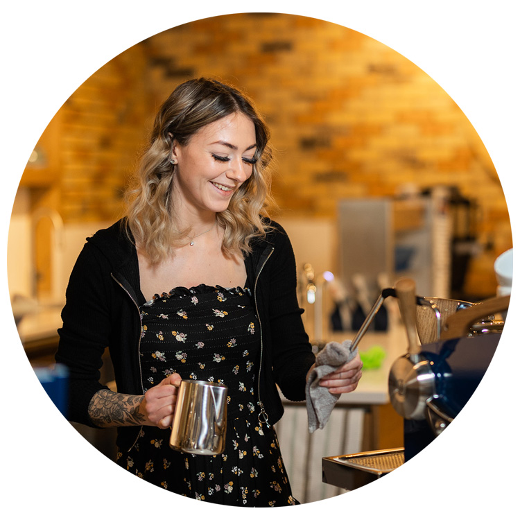 a barista at Andromeda Coffee, a local jasper coffee shop